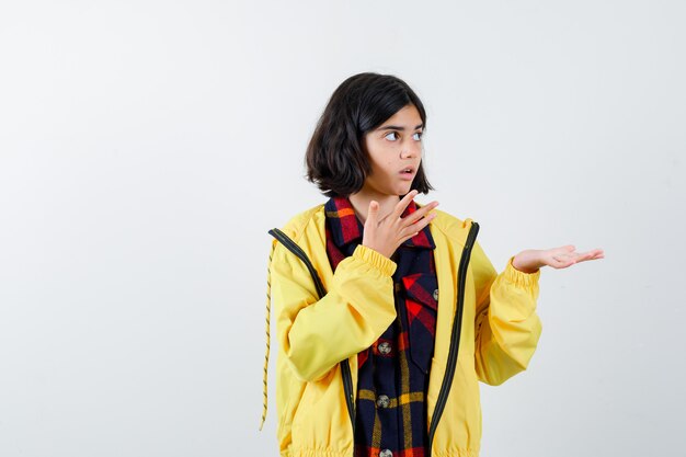 Expressive young girl posing in the studio