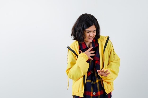 Expressive young girl posing in the studio