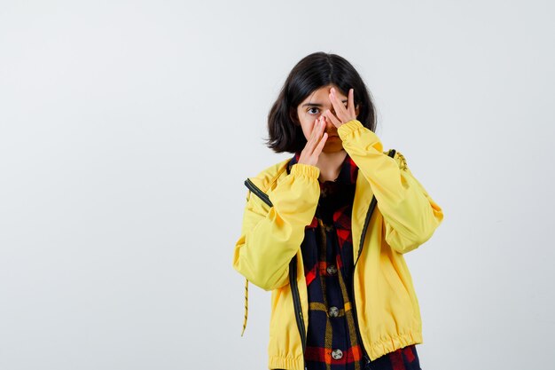 Expressive young girl posing in the studio