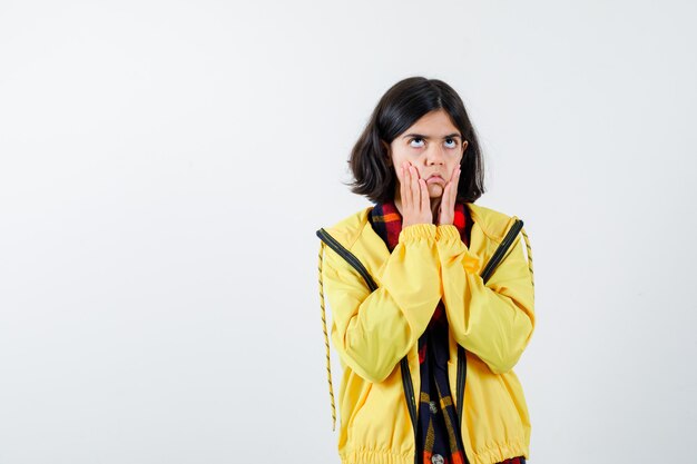 Expressive young girl posing in the studio