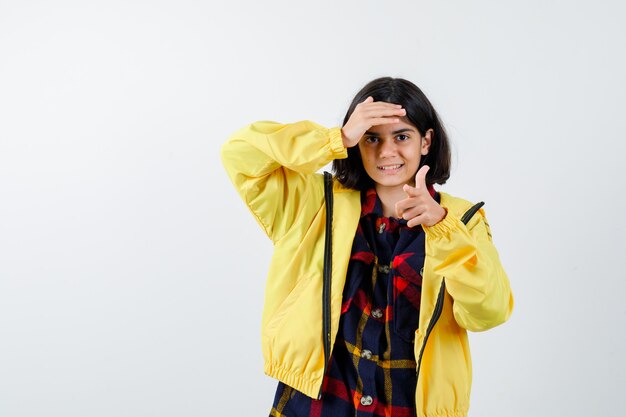 Expressive young girl posing in the studio