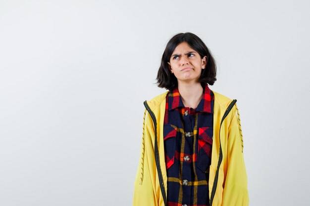 Expressive young girl posing in the studio