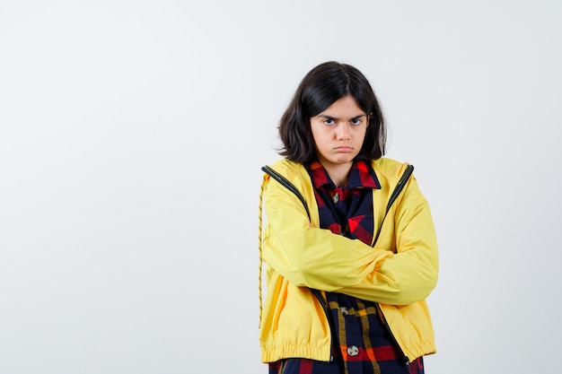 Expressive young girl posing in the studio