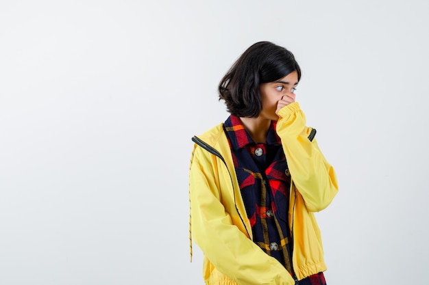 Expressive young girl posing in the studio