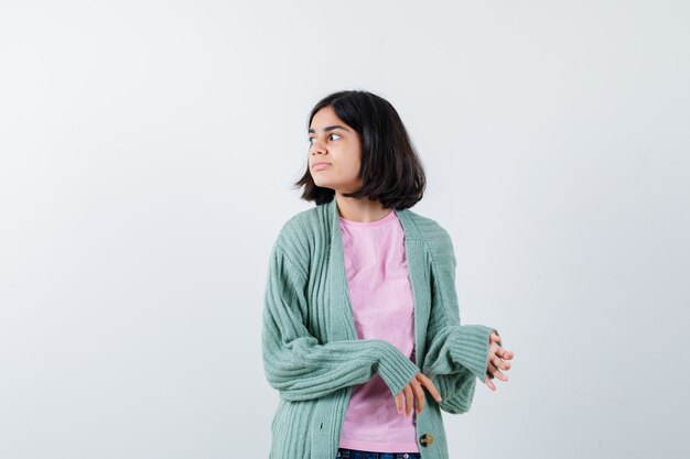 Expressive young girl posing in the studio