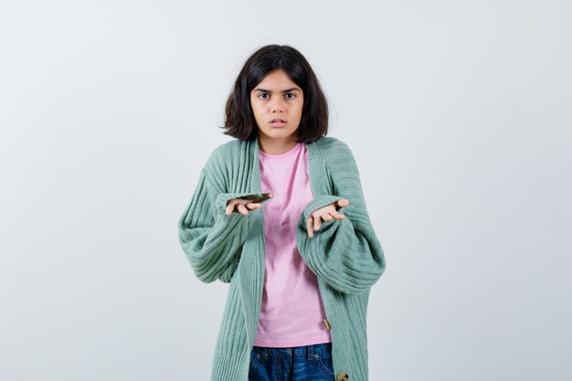 Expressive young girl posing in the studio