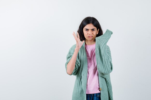 Expressive young girl posing in the studio