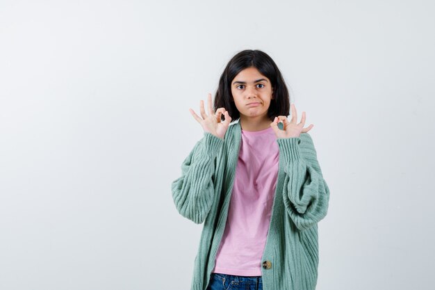 Expressive young girl posing in the studio