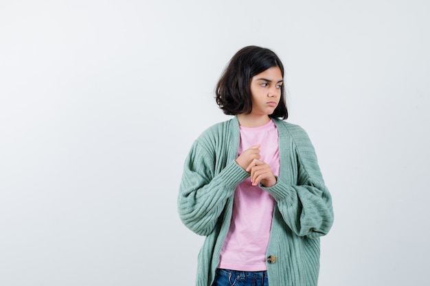 Expressive young girl posing in the studio