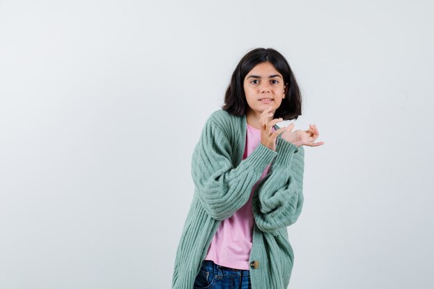 Expressive young girl posing in the studio