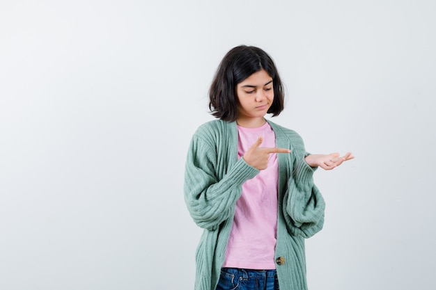 Expressive young girl posing in the studio