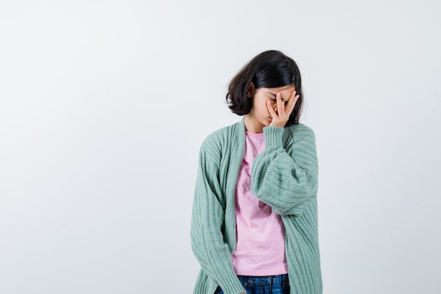 Expressive young girl posing in the studio