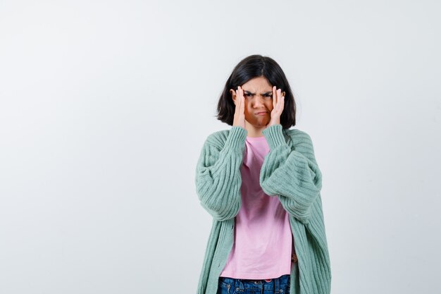 Expressive young girl posing in the studio