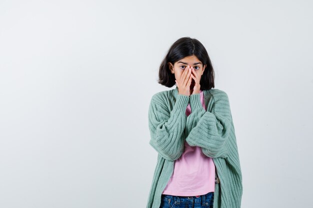 Expressive young girl posing in the studio