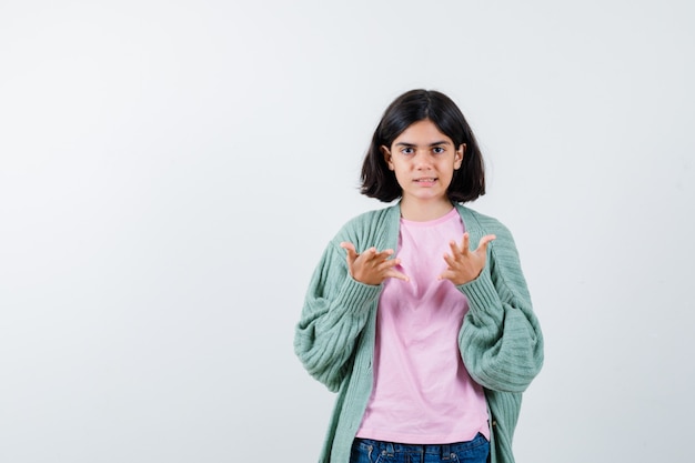 Expressive young girl posing in the studio