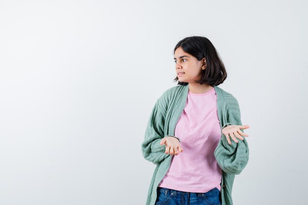 Expressive young girl posing in the studio