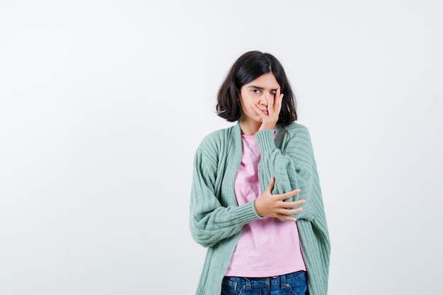 Expressive young girl posing in the studio