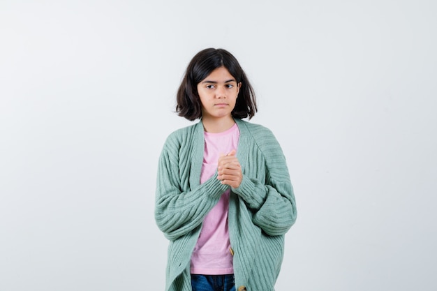 Expressive young girl posing in the studio