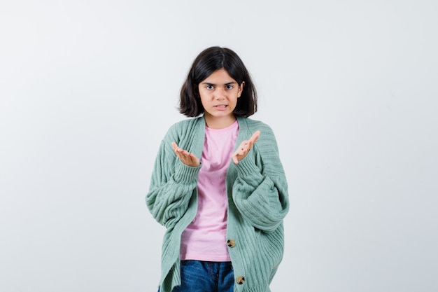 Expressive young girl posing in the studio