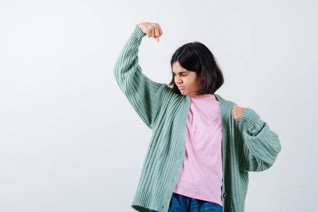 Expressive young girl posing in the studio