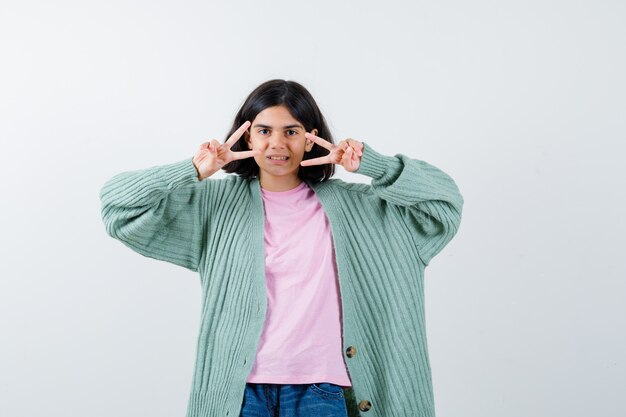 Expressive young girl posing in the studio