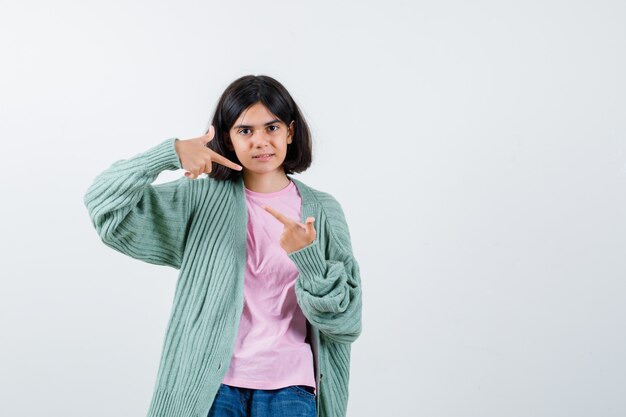 Expressive young girl posing in the studio