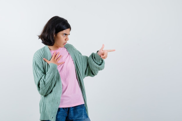 Expressive young girl posing in the studio