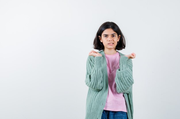 Expressive young girl posing in the studio