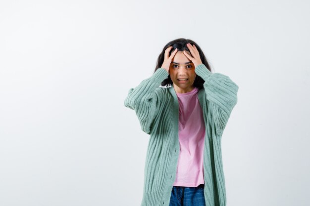 Expressive young girl posing in the studio