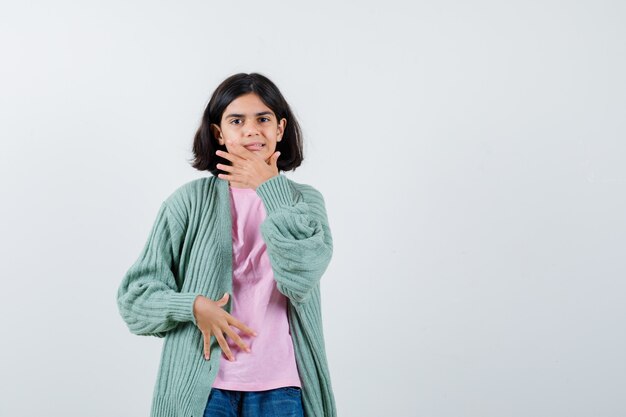 Expressive young girl posing in the studio