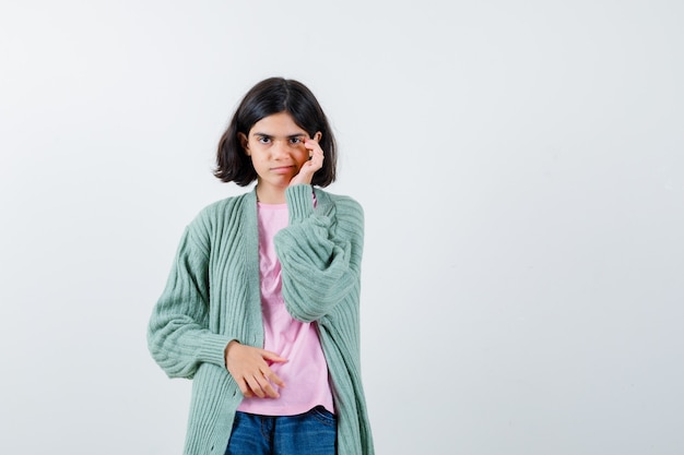 Expressive young girl posing in the studio