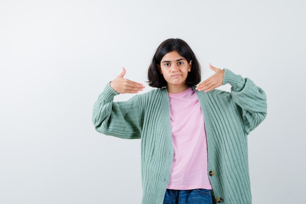 Expressive young girl posing in the studio