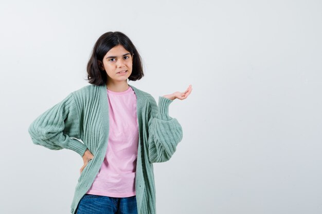 Expressive young girl posing in the studio