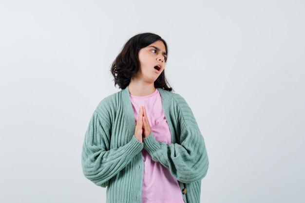 Expressive young girl posing in the studio