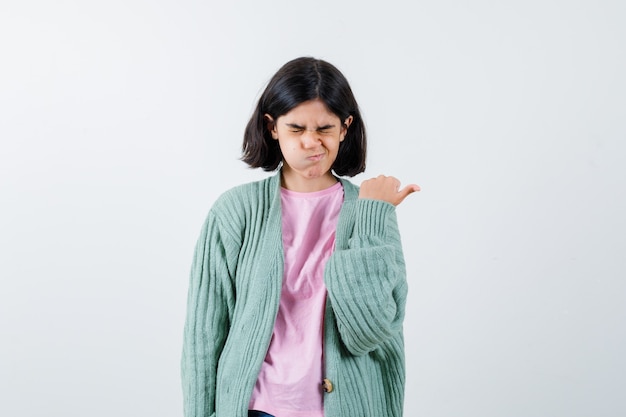 Expressive young girl posing in the studio