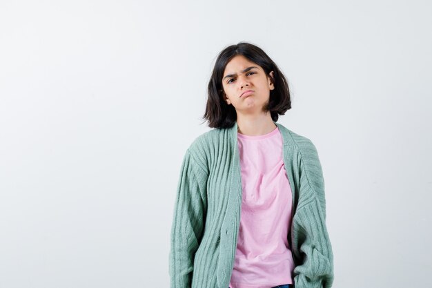 Expressive young girl posing in the studio