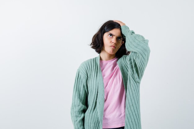 Expressive young girl posing in the studio