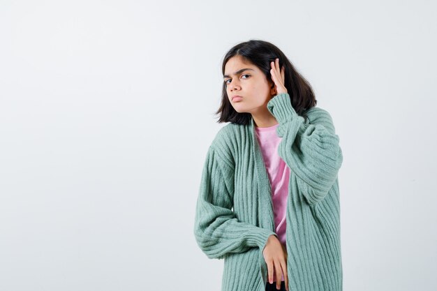 Expressive young girl posing in the studio