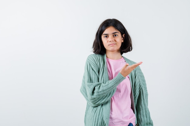 Expressive young girl posing in the studio