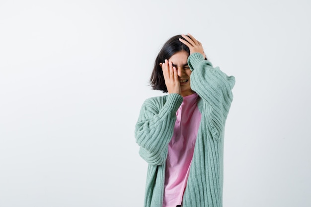 Expressive young girl posing in the studio