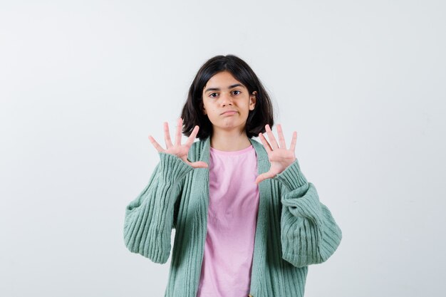 Expressive young girl posing in the studio