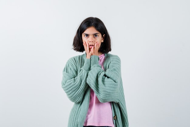 Expressive young girl posing in the studio