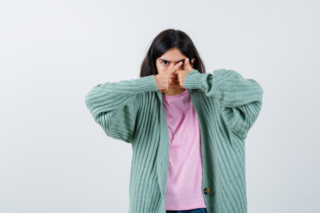 Expressive young girl posing in the studio