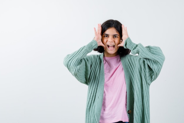 Expressive young girl posing in the studio