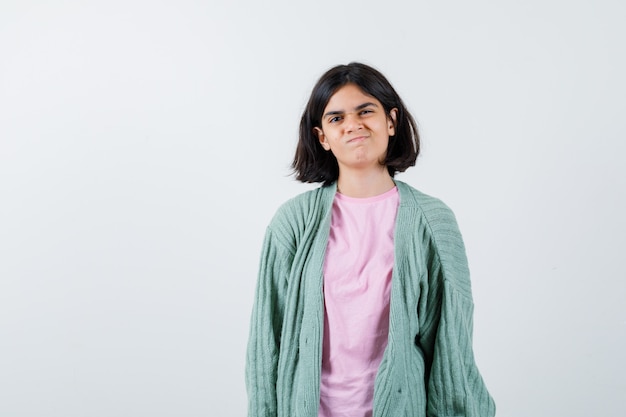 Expressive young girl posing in the studio