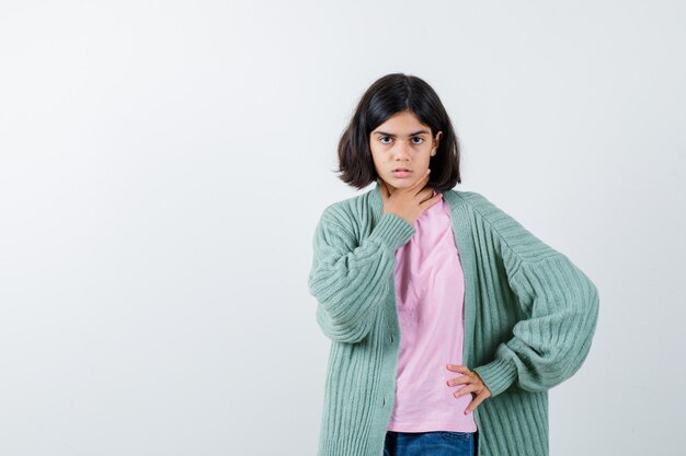 Expressive young girl posing in the studio