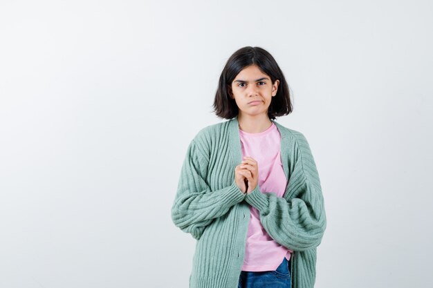 Expressive young girl posing in the studio