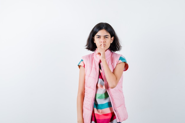 Expressive young girl posing in the studio