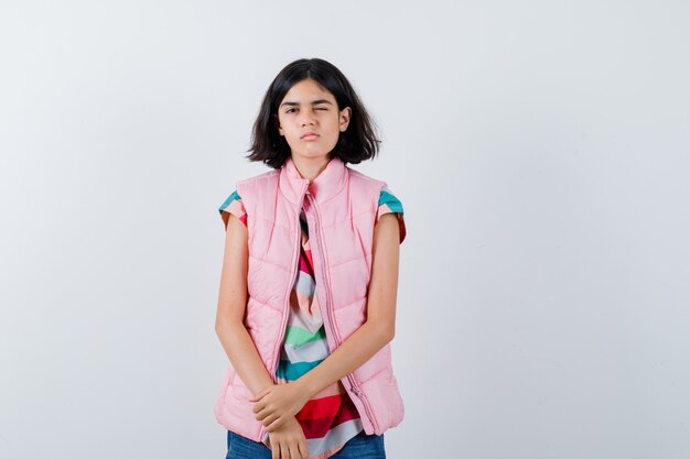 Expressive young girl posing in the studio