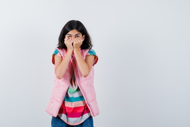 Expressive young girl posing in the studio